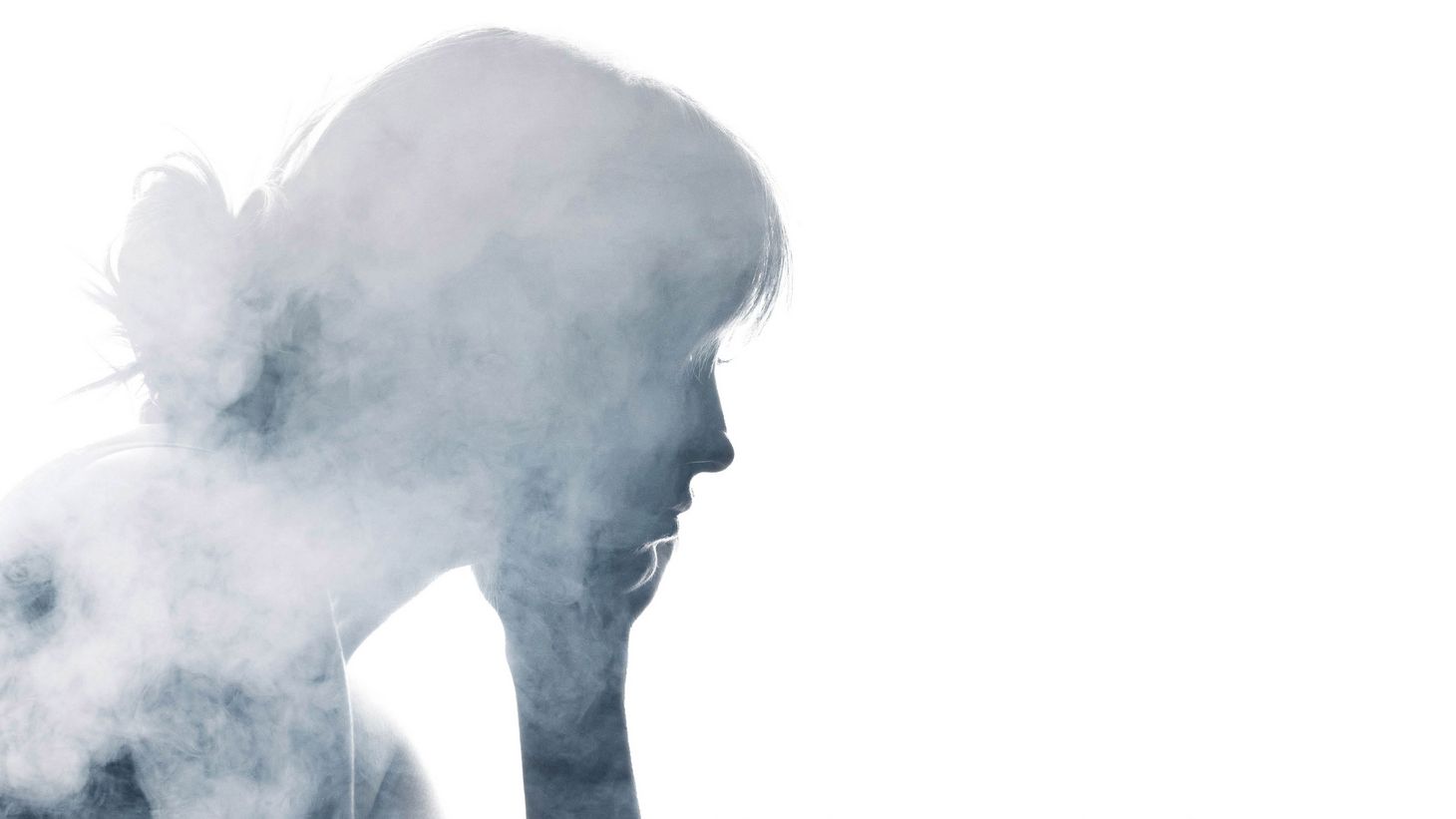 silhouette portrait of woman with smoke overlaid