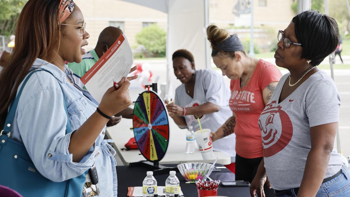 women talking at a health fair