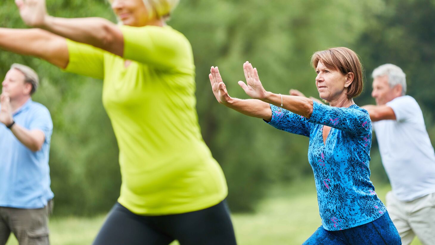 Seniors do Tai Chi exercise