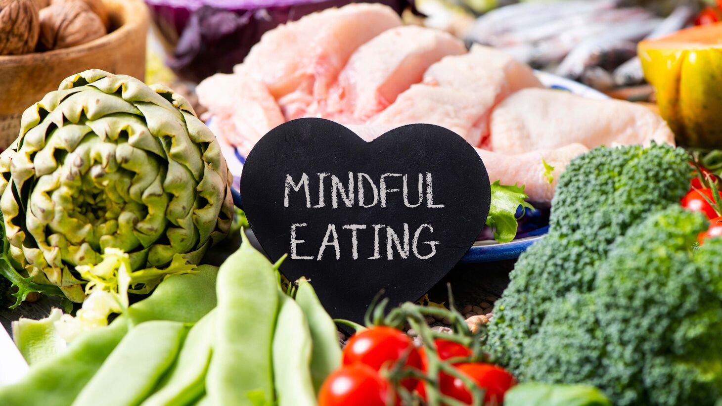 assortment of produce with a sign that says "mindful eating" in the center