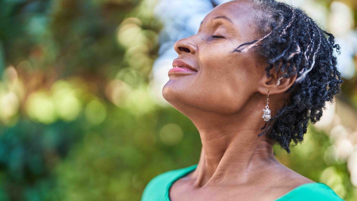 African American woman outside practicing mindfulness