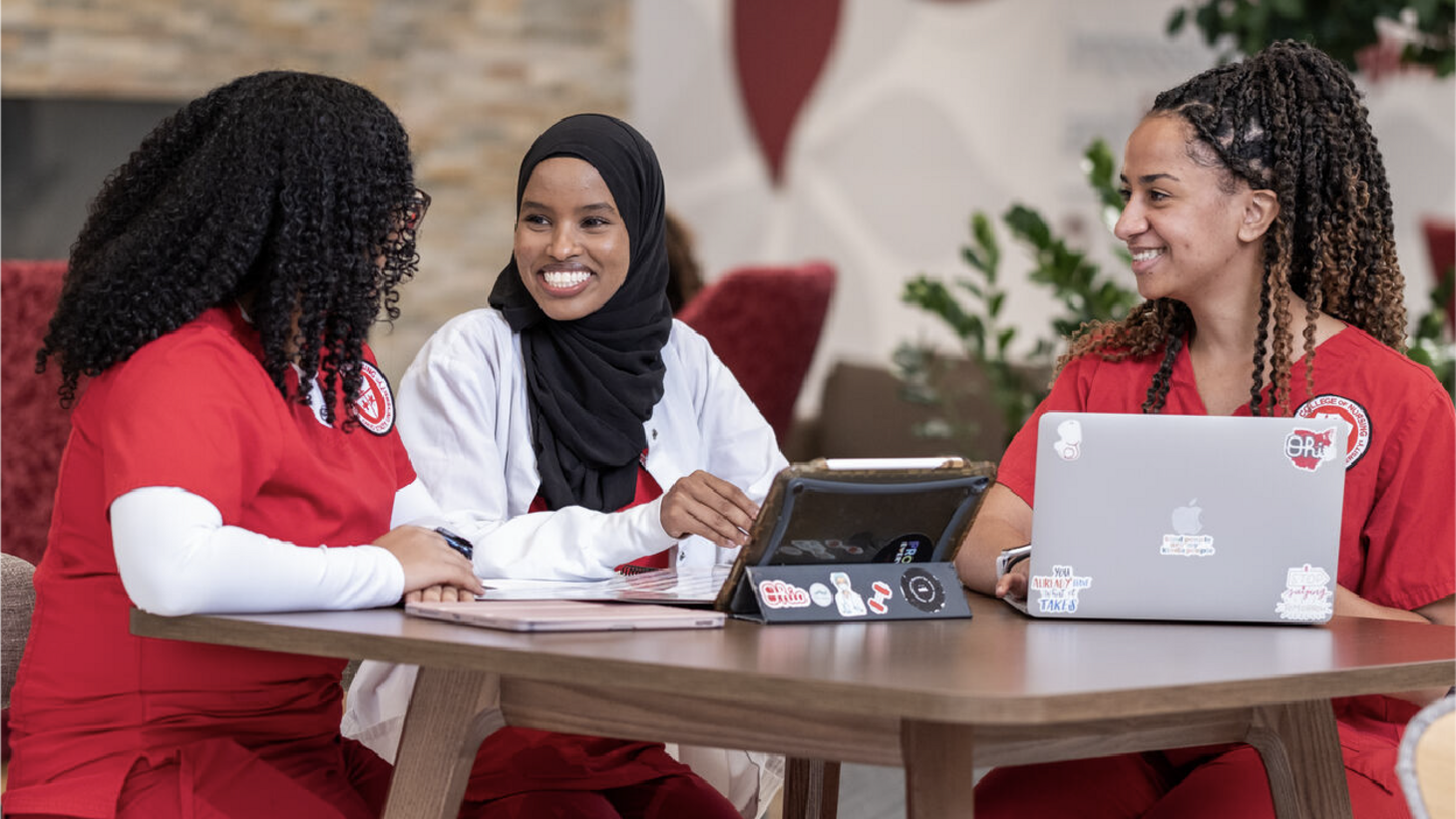 Nursing students sitting around a table