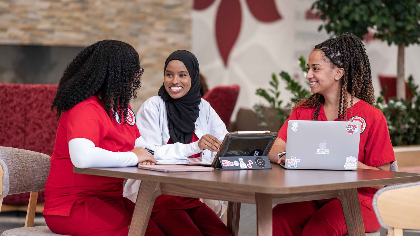 nursing students in the atrium of Heminger Hall
