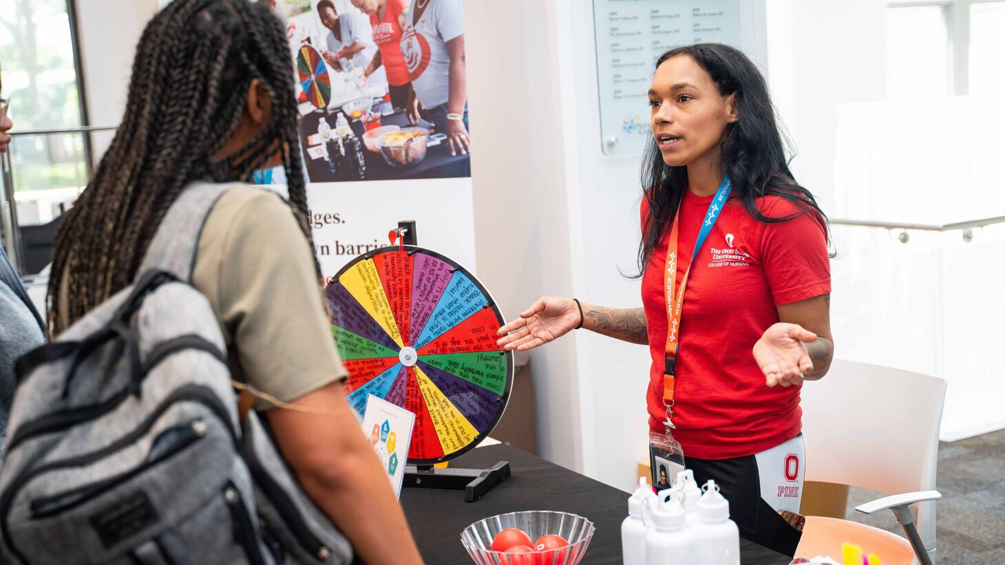 Community Health Worker interacting with a woman
