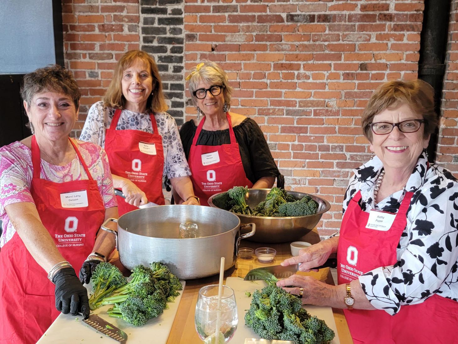 alumni society members pose during Buckeyes in the Kitchen event