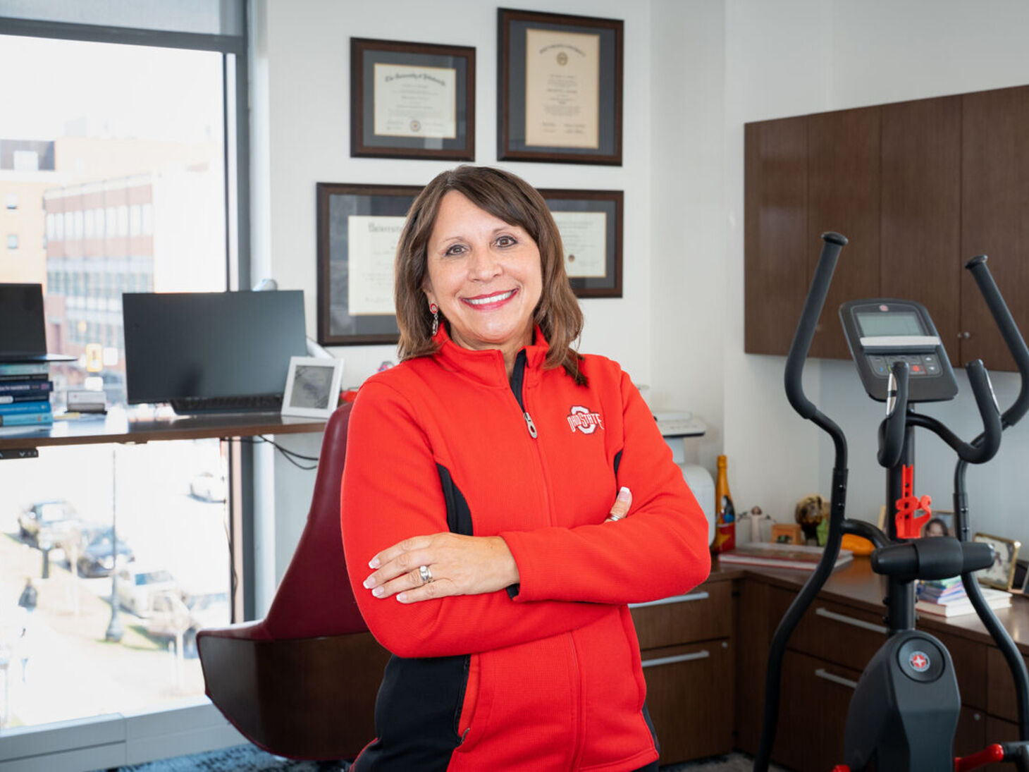 Bern Melnyk standing in office with exercise equipment