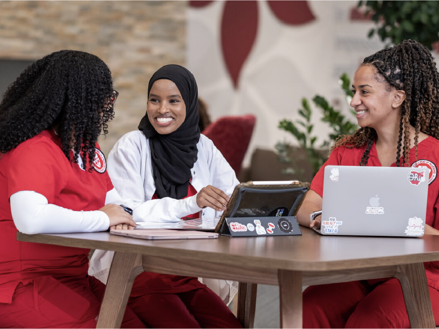 Nursing students sitting around a table
