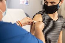 Person receiving a vaccine.