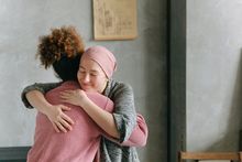 cancer patient hugging caregiver
