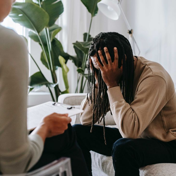 Stressed black man with dreadlocks in psychological office | Photo by Alex Green from Pexels
