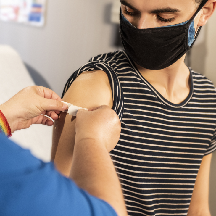 Person receiving a vaccine.