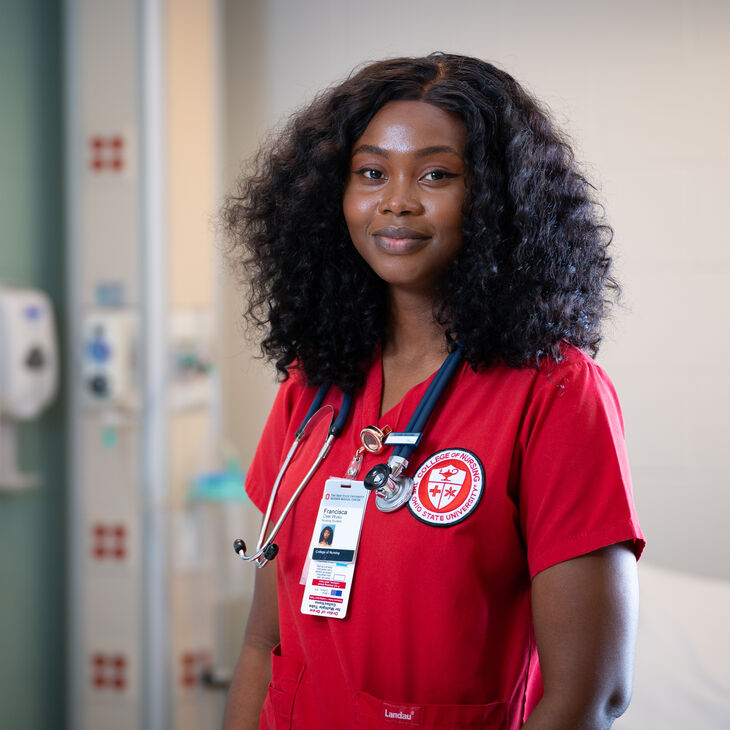 nurse in red scrubs