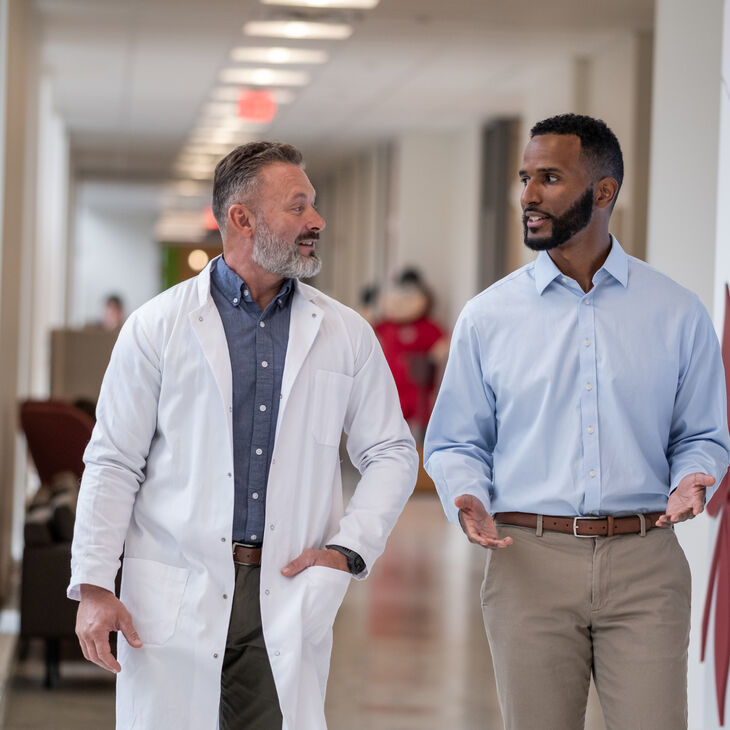 two healthcare professionals talking