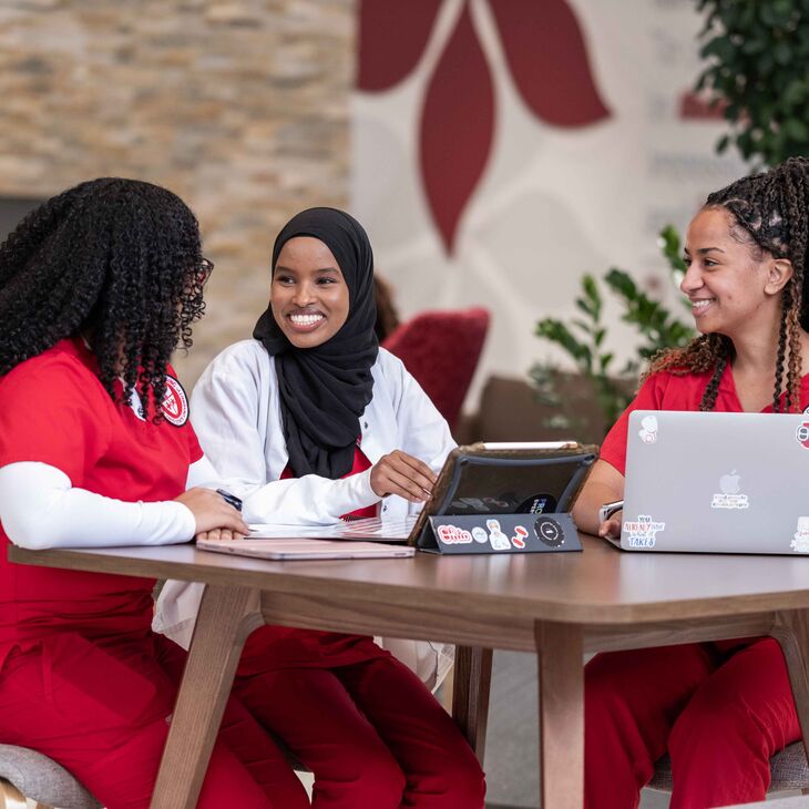 nursing students in the atrium of Heminger Hall
