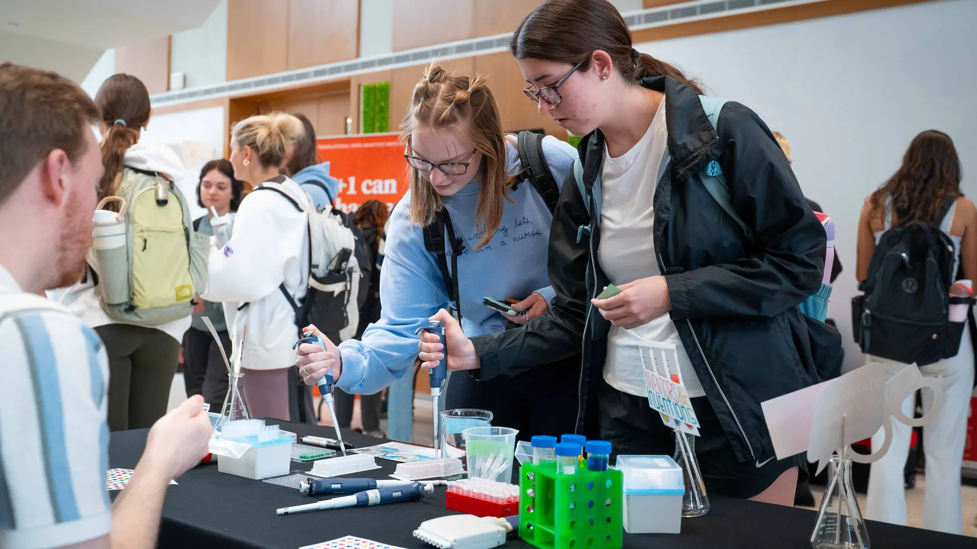 nursing students practice micropipetting at Research Day