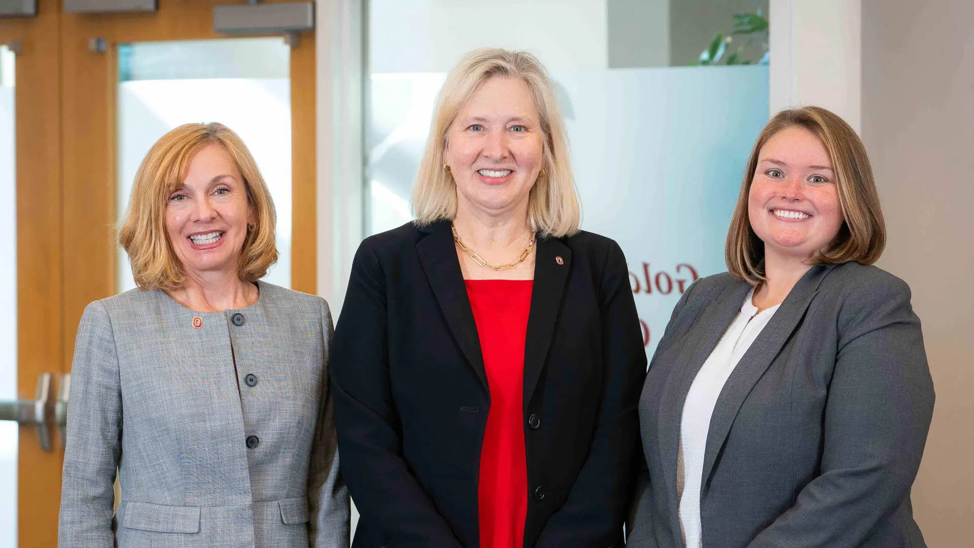 Mary Beth Happ, Karen Rose and Morgan Angles pose in the Golden Buckeye Center for Dementia Caregiving