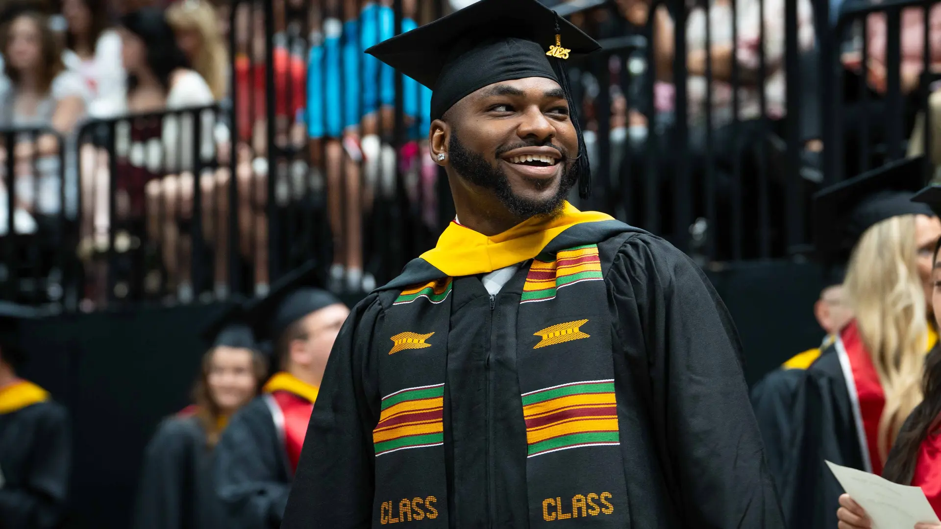 student walking at convocation