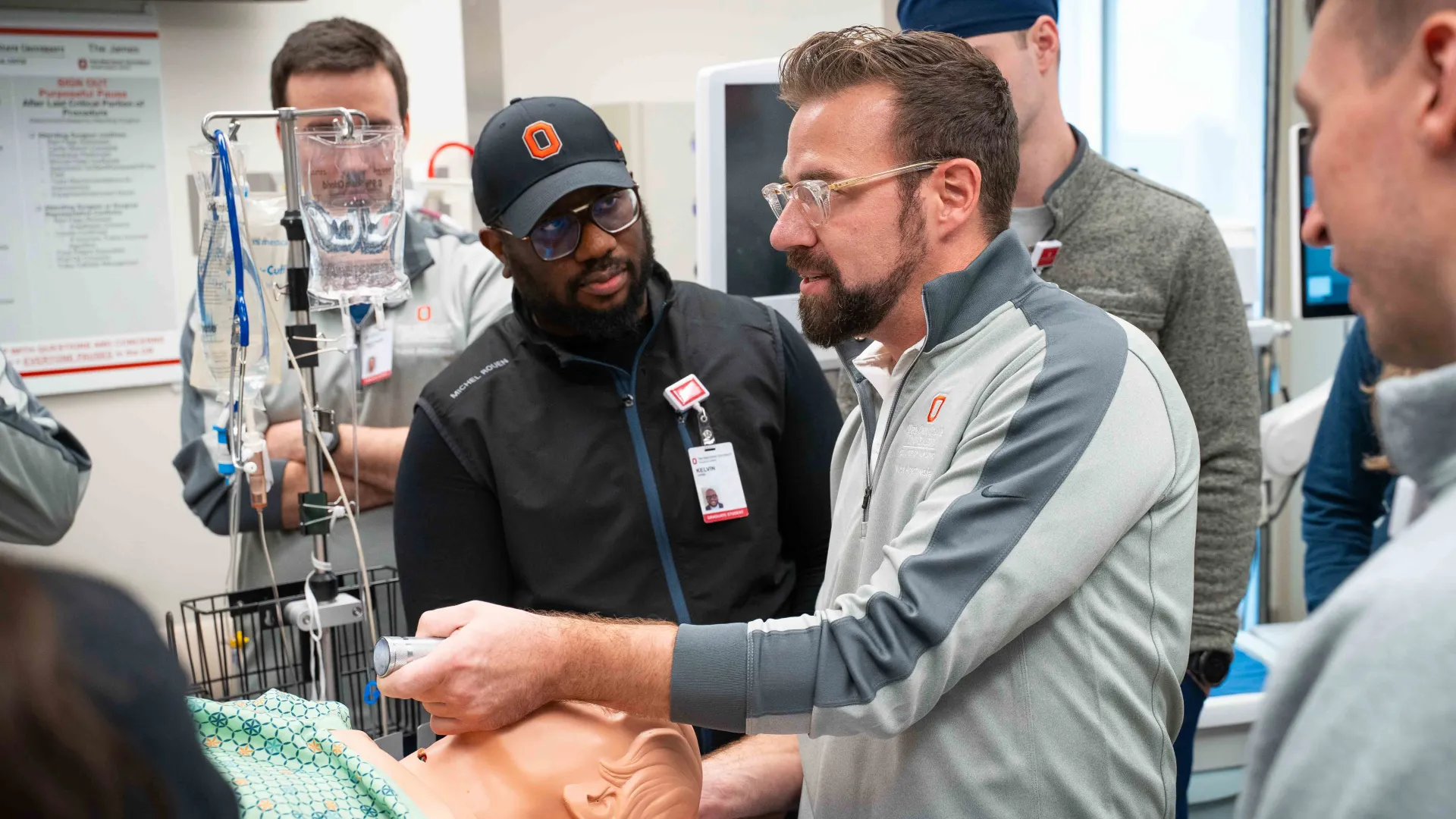 director of nurse anesthesia specialty, John Welch, leads students through a lab