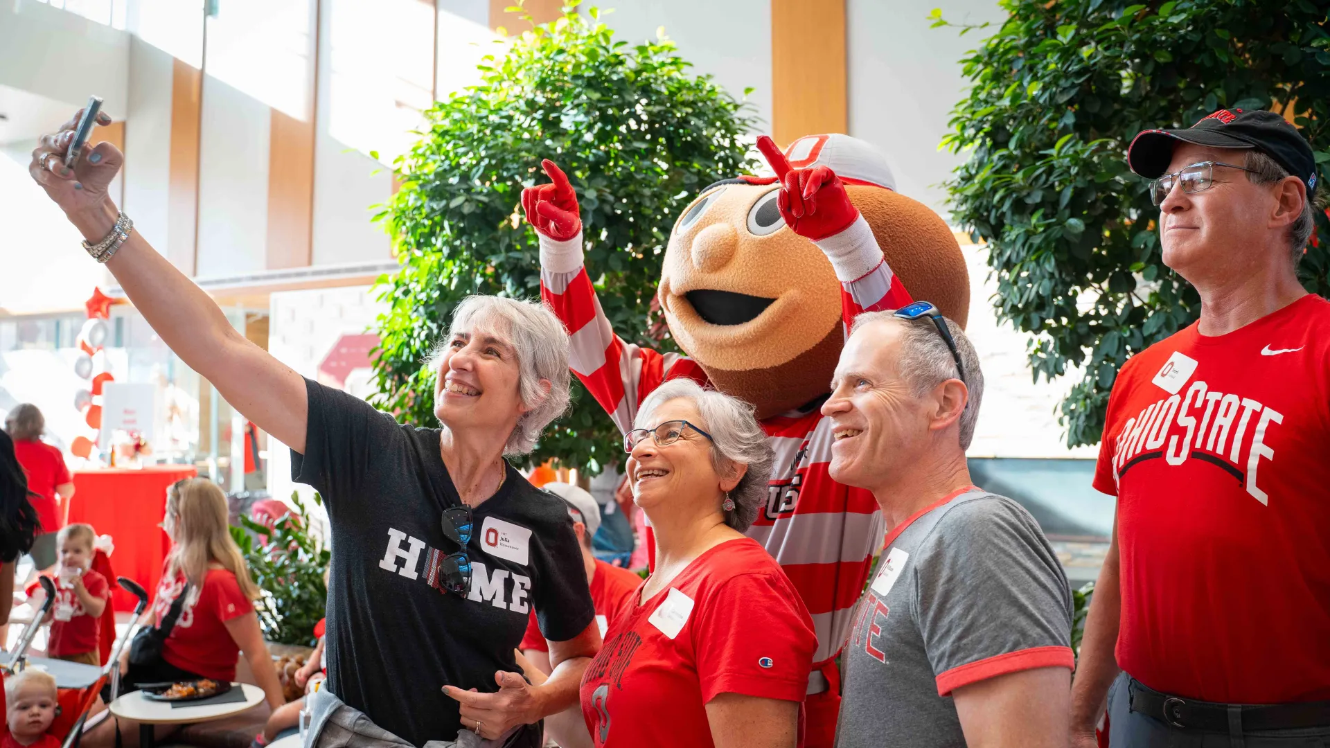 group of alumni taking a selfie with Brutus