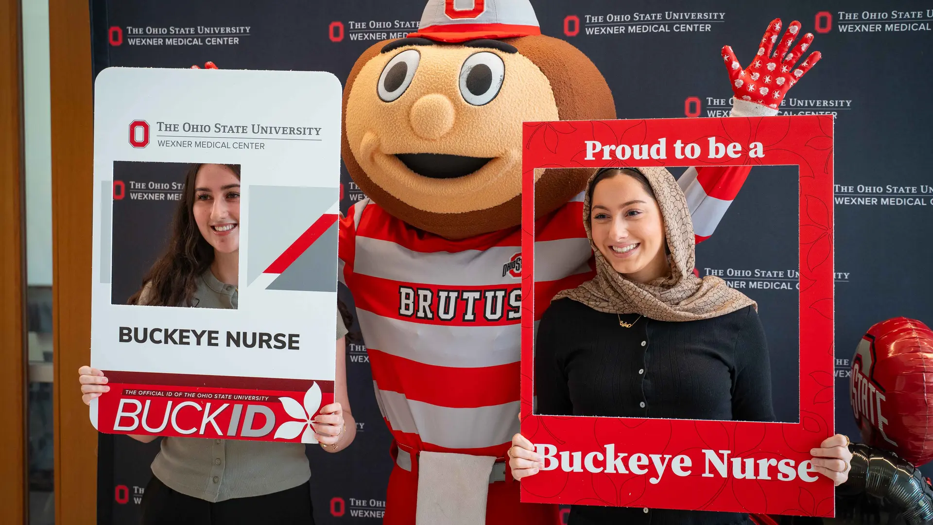 Students poe with Brutus on signing day 
