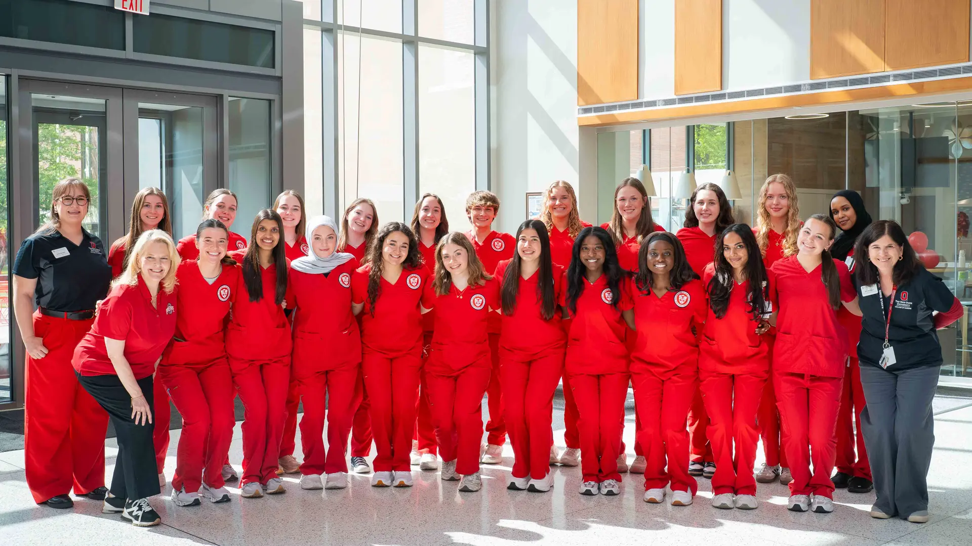 student ambassadors pose for a group photo in heminger hall